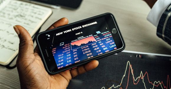 Stock Market - A Person using a Smartphone