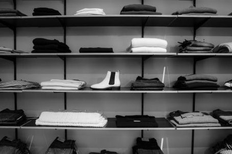 Stock - Grayscale Photography of Assorted Apparels on Shelf Rack