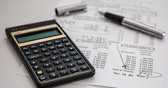 Accountant - Black Calculator Near Ballpoint Pen on White Printed Paper