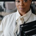 Accountant - Confident Female Accountant Carrying Documents