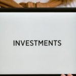 Investments - Close-Up Shot of a Person Holding a Tablet